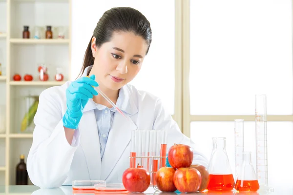Asian female scientist happy to research for genetic modificatio