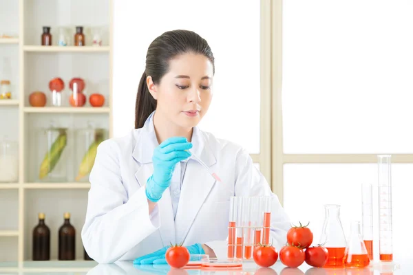 Female scientist looking for new genetic modification