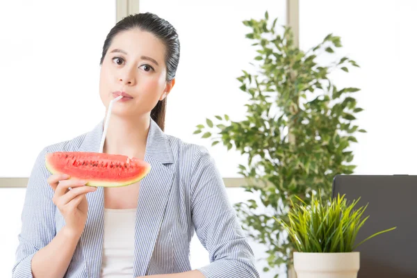 Asian business woman drinking summer sweet fruit watermelon