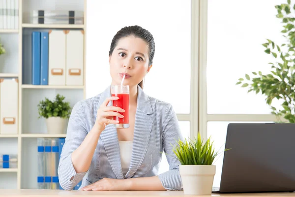 Asian business woman enjoy to drinking fresh watermelon juice