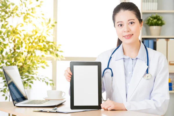 Doctor using digital tablet to show patient\'s medical case