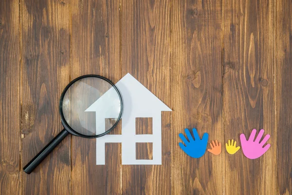 Family Searching house conceptual, paper house with Magnifier