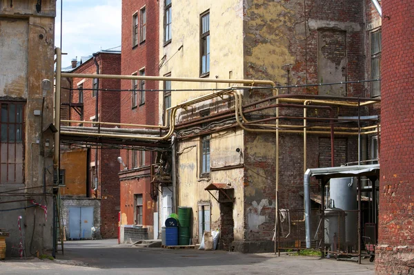 Grungy yard of a small factory in Russia