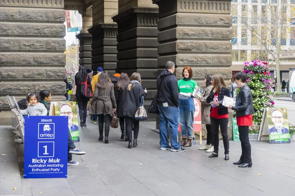 Volunteers and electors at Melbourne Town Hall for federal election