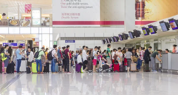 Passengers queuing up in check-in counter in the Hong Kong International Airport