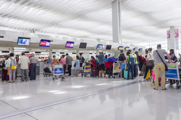 Passengers queuing up in check-in counter in the Hong Kong International Airport