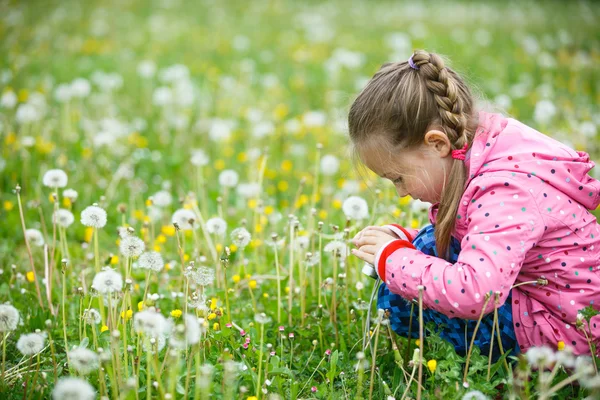 Little girl photographing with her smart phone