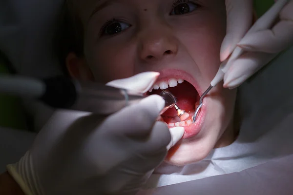 Girl getting her teeth polished