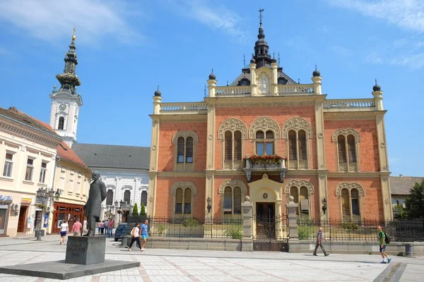 Statue J. J. Zmaj and neo-classical architecture of Vladicin Court Palace of Bishop in Novi Sad