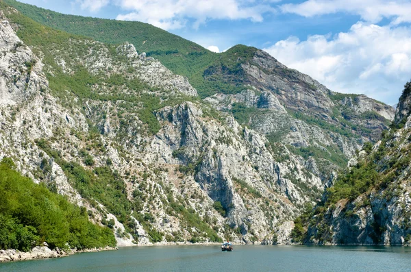 Small Boat And Steep Cliffs Of Koman-Fierza Lake, Albania