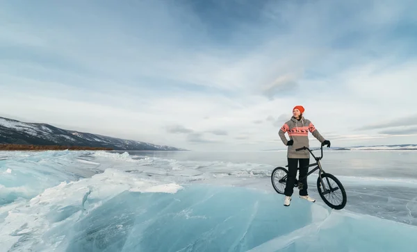 Girl on a bmx on ice.