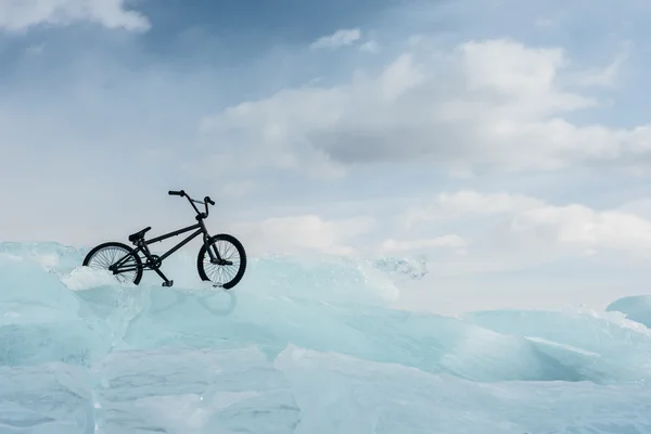 Girl on a bmx on ice.