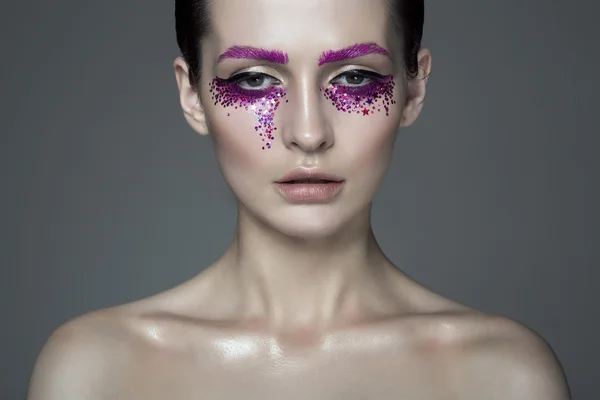 Young fashion model woman with beautiful makeup