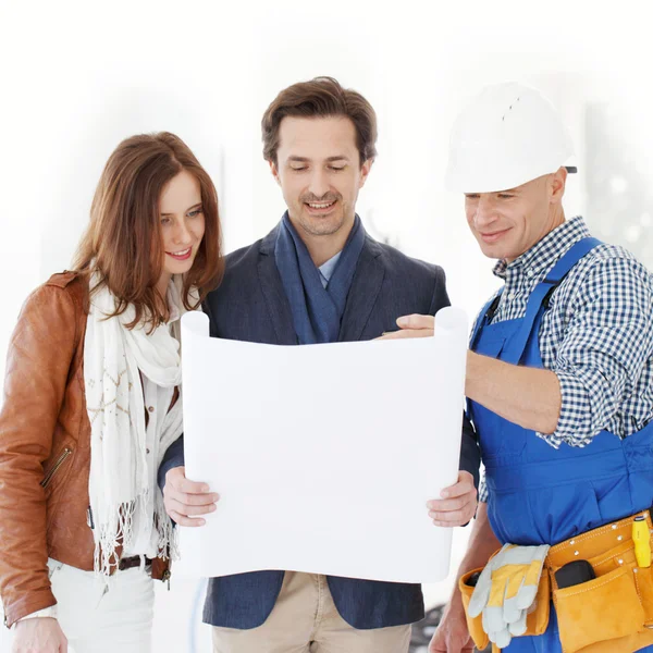 Worker shows house design plans