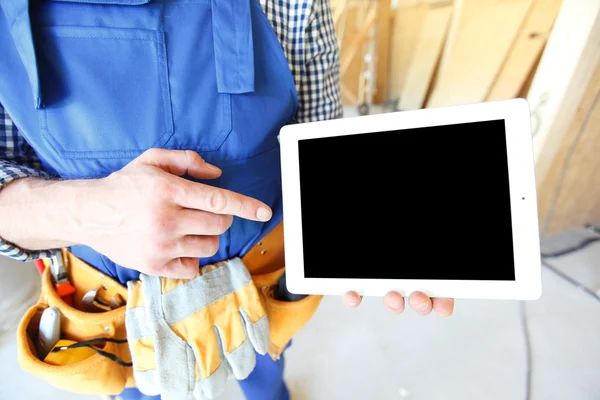 Worker pointing at tablet