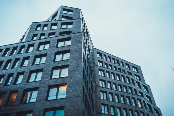 Street level view of office building on cloudy day