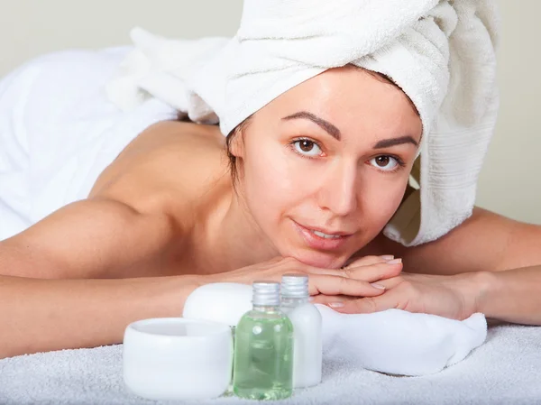 Closeup portrait of attractive woman enjoying day spa in luxury beauty salon