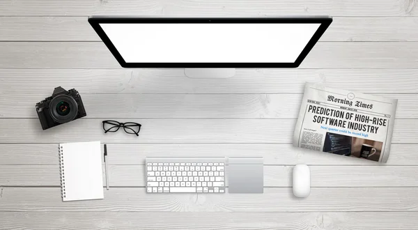 Isolated computer display for mockup on work desk with keyboard, mouse, newspaper, coffee, camera