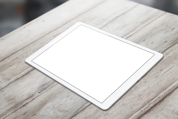 White tablet on wooden table with isolated white screen for mockup. Horizontal position isometric view.