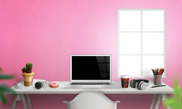 Laptop on office desk. Plant, camera, paper, pens, coffee, donut