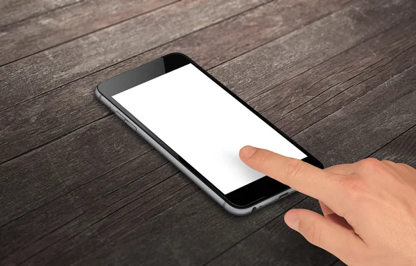 Man touch smart phone with isolated white screen for mockup. Isometric view phone on table.