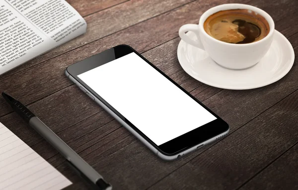 Smart phone with isolated white screen for mockup. Isometric view phone on table with coffee, pen, paper.
