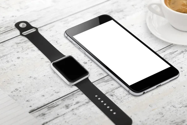 Smartwatch and phone with blank screen for mockup. Isometric view. Cup of coffee beside on table.