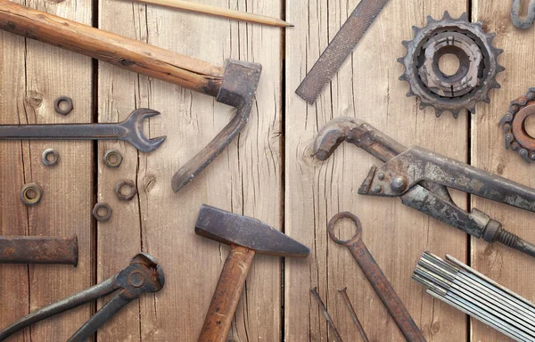 Old vintage tools on wooden table. Traditional handmade tools for craftsmen.