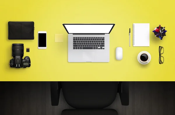 Photographer or designer work desk. Top view off yellow desk.