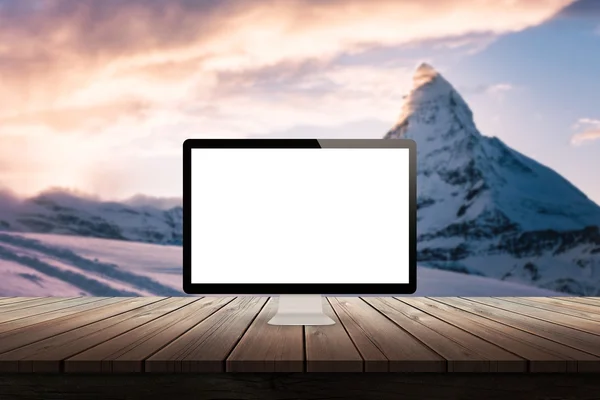 Computer display on desk with mountain in the background mock up presentation