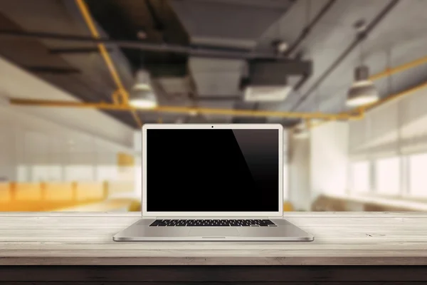 White laptop on the desk in the office mockup presentation