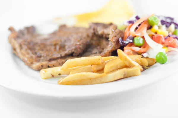 The french fries in beef steak and Vegetable salad with cheese b