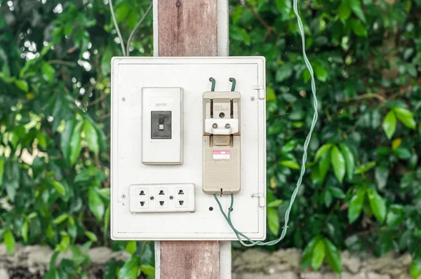 The modern breaker switch and the old breaker switch with white