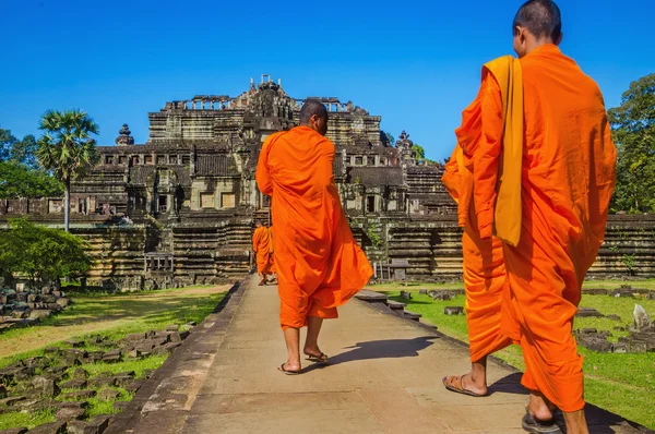 Buddhist monks in traditional orange robes