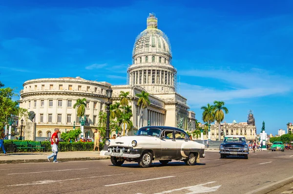 Classic American car in front of Capitol, Havana