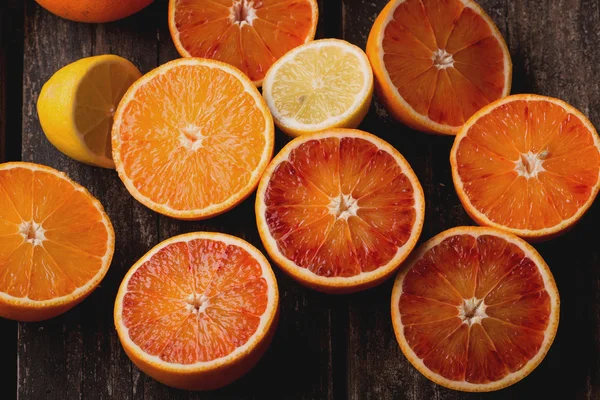Bloody Oranges on rustic background