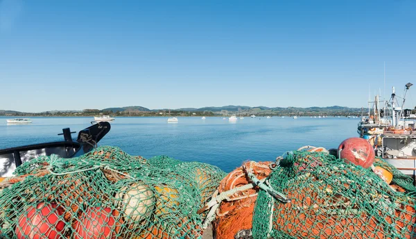 Blue sky fishing nets on fishing wharf, Tauranga.