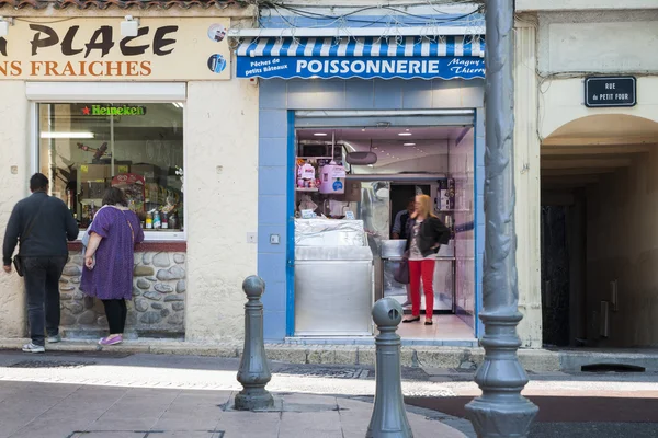 Antibes street scene retail shop fronts and people