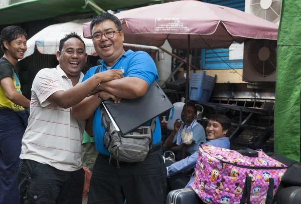 Two happy men in back street on Yangon Myanmar Travel Images