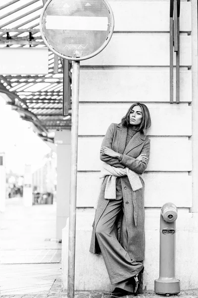 Brunette girl posing in city