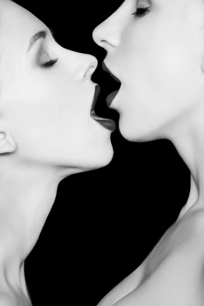 Two women kissing