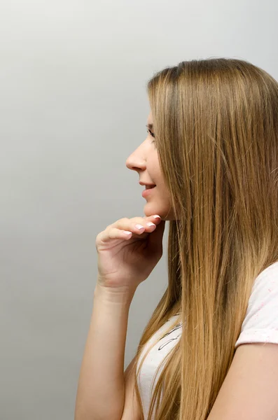 Portrait of young gorgeous brunette woman thinking