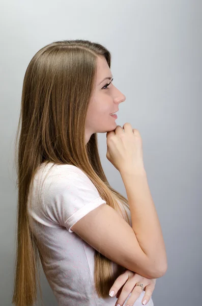 Portrait of young gorgeous brunette woman thinking