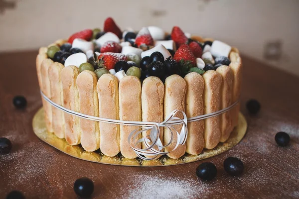 Cake with fruit, berries and Savoiardi