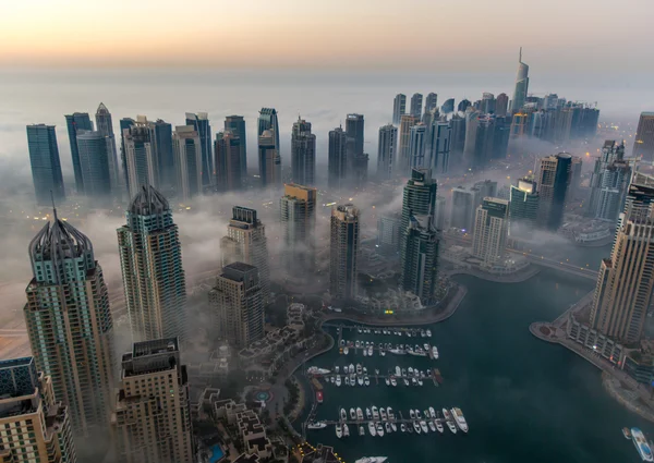 View foggy weather Dubai Marina at sunrise