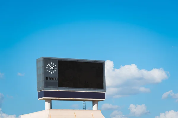 Score board at football stadium with bluesky