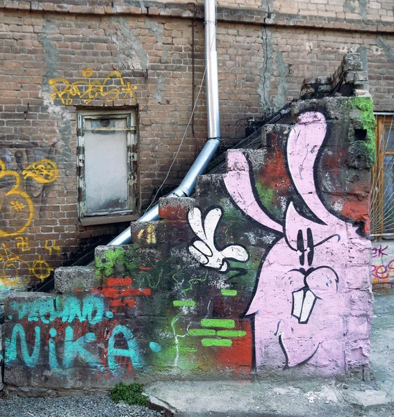 Graffiti of rabbit on wall of house