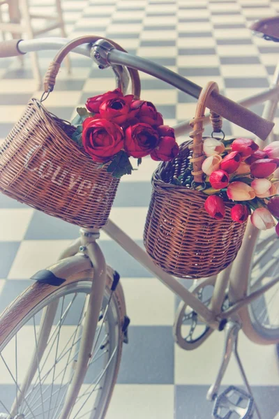 Bicycle with baskets of flowers