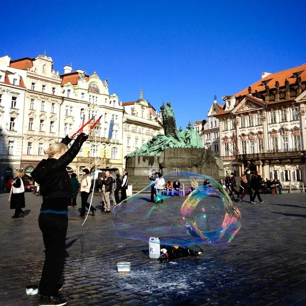 Artist makes soap bubbles in street