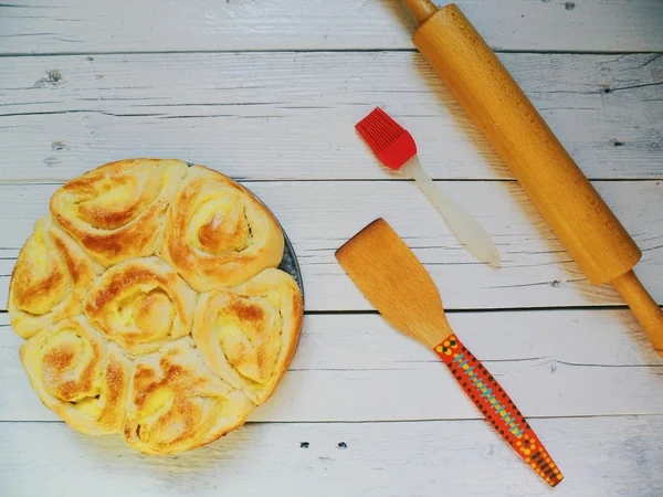 Homemade cake, homemade cakes, a rolling pin, brush on a white background
